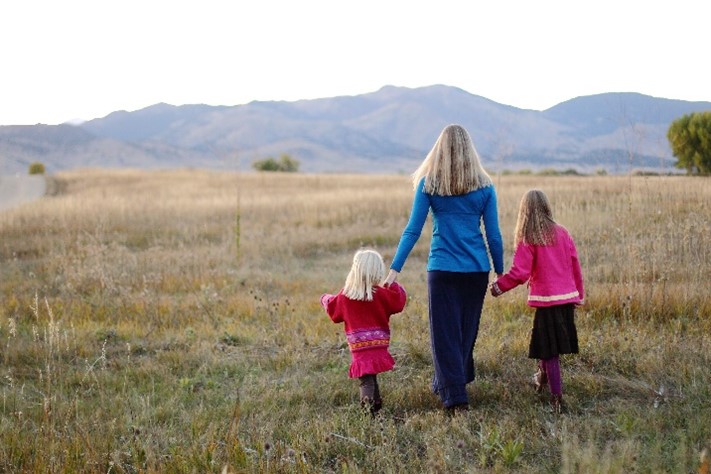 stephanie walking hand in hand with her children