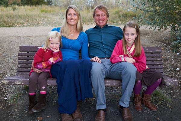 photo of dr. stephanie dueger with her husband and two daughters